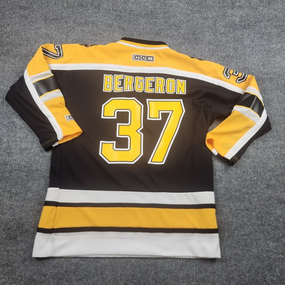 CCM NHL Boston Bruins Patrice Bergeron 37 Youth L/XL Jersey Black Gold Hockey